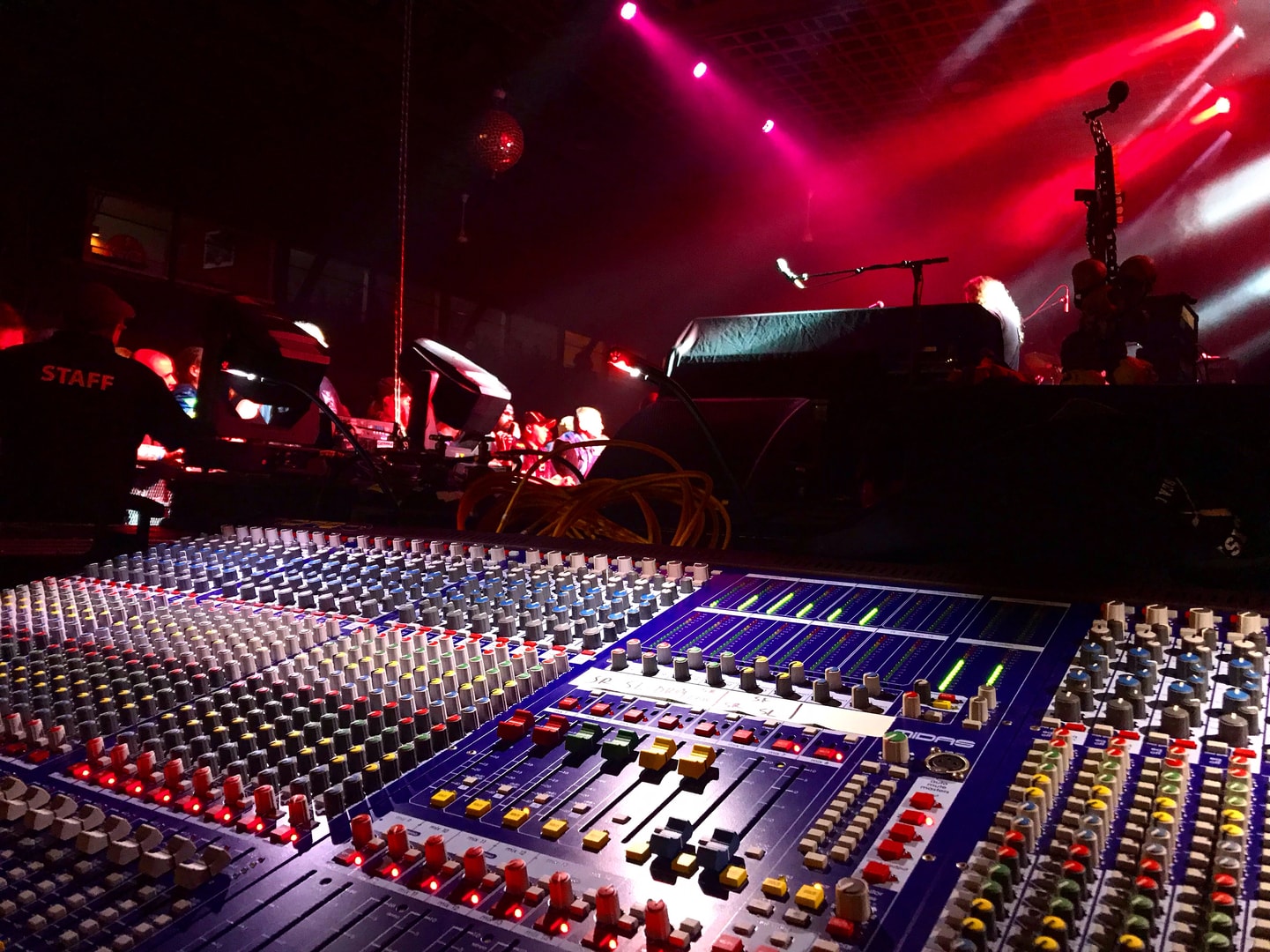 Concert mixing board with dramatic stage lighting